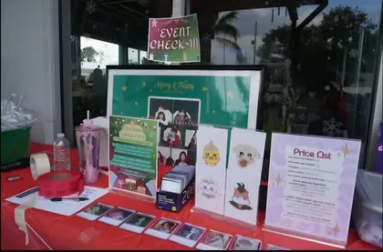 Event check-in table with photocards lined up along the front edge
